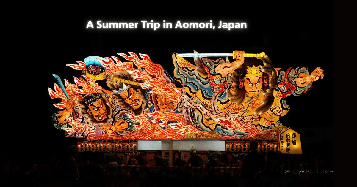 A large illuminated Nebuta float featuring fierce warrior figures surrounded by flames, with the text “A Summer Trip in Aomori, Japan” above.