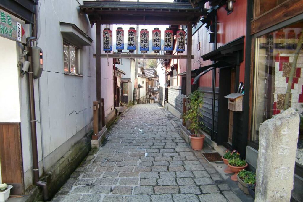 Stone-paved alley in Gujo Hachiman leading to Yanaka Mizu-no-Komichi and Sogi-sui spring.