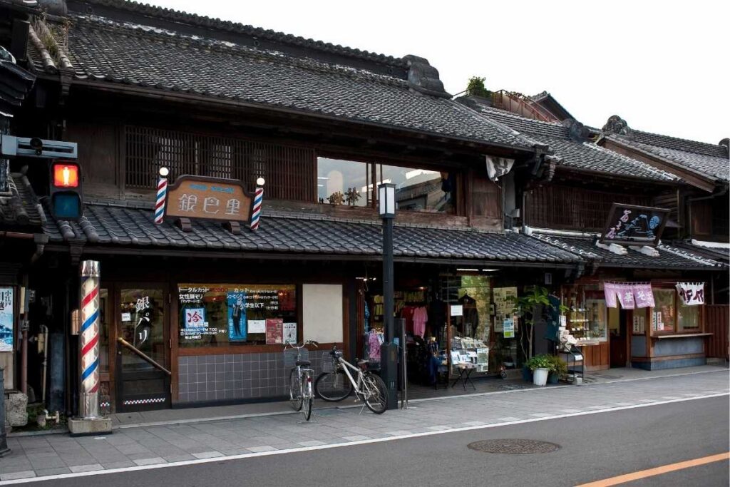 Traditional kura-style buildings lining a shopping street in Kawagoe, known as Little Edo