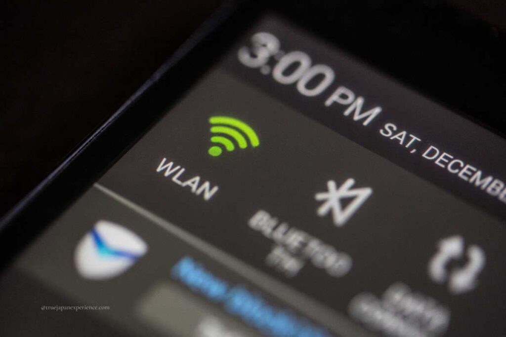 Close-up of a smartphone screen showing a Wi-Fi (WLAN) signal icon