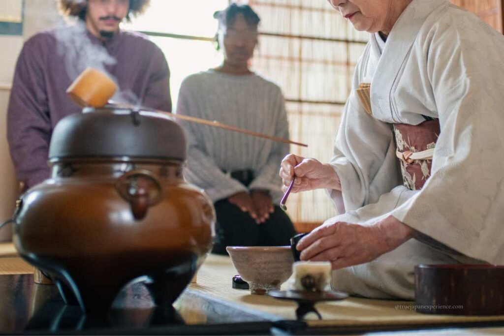 A matcha experience with a kimono instructor and international participants in a Japanese-style room