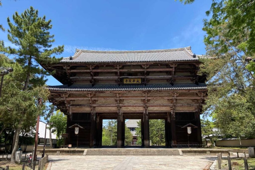 View of the Nandaimon Gate, the main entrance to Todai-ji Temple in Nara, Japan, on a sunny day