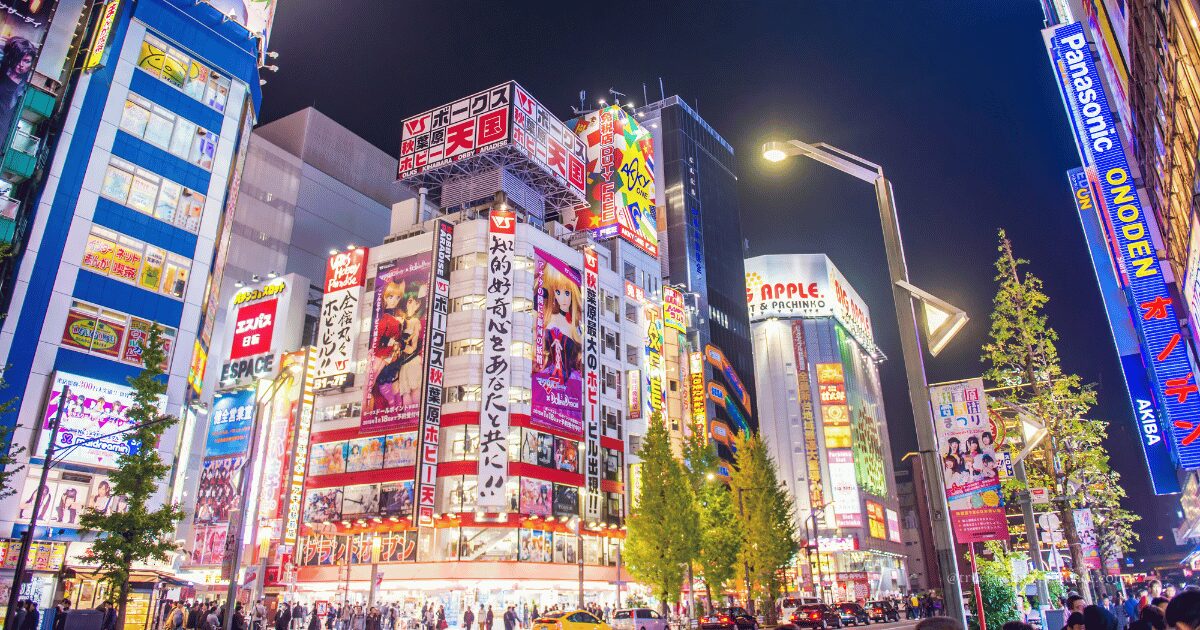 Bright neon lights and anime billboards in Akihabara at night, showing the lively streets of Tokyo’s otaku culture district.