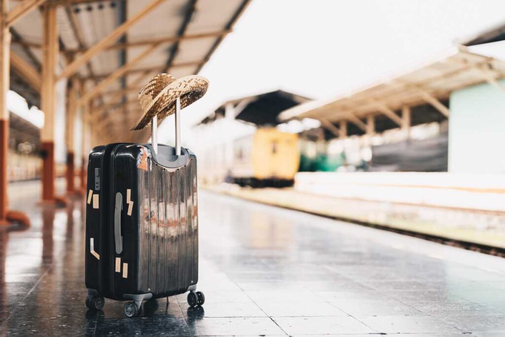 Traveler’s luggage on a railway platform, waiting for a train